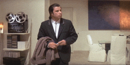 A looping GIF of Vincent Vega from Pulp Fiction looking around all confused